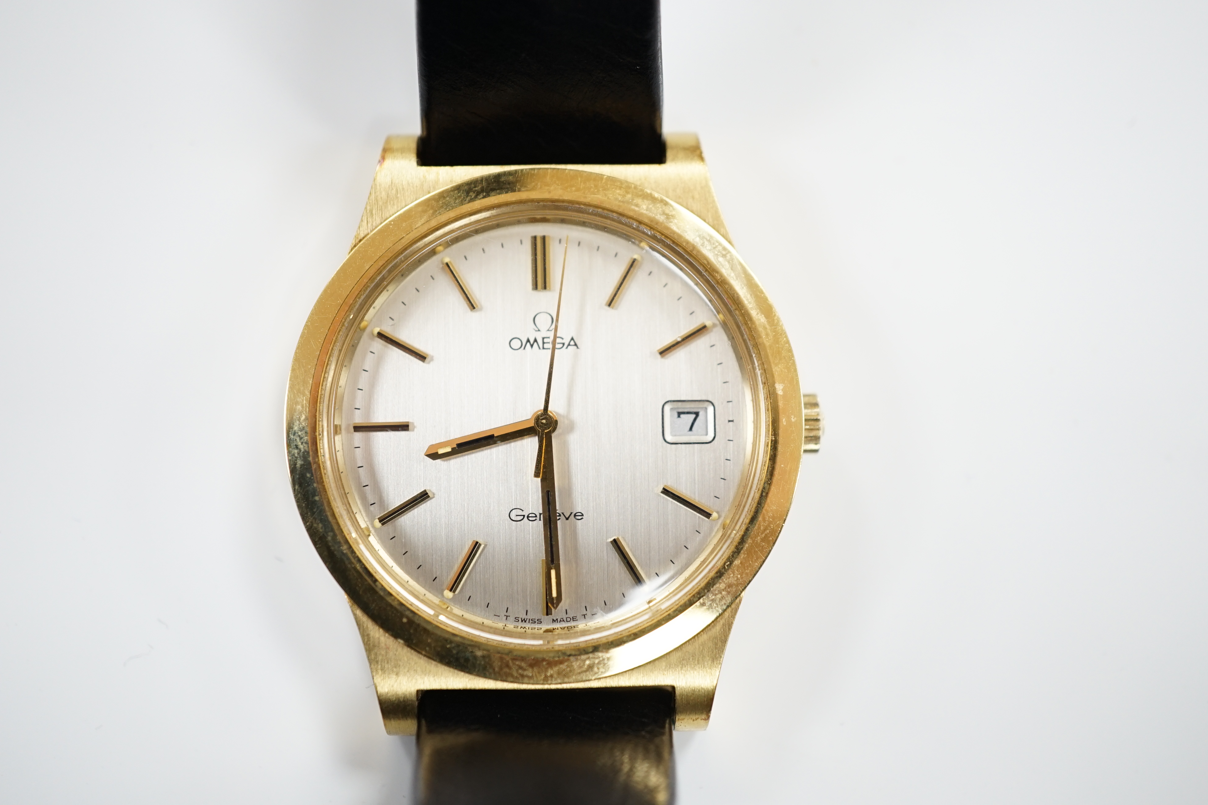 A gentleman's steel and gold plated Omega manual wind wrist watch, with date aperture, on an Omega leather strap with Omega buckle, case diameter 37mm, with box, no papers.